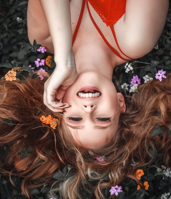 Smiling woman after a yoga session, looking relaxed.